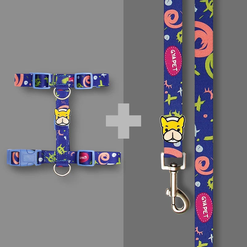 Striped dog harness and leash set in blue with cartoon face patch and metal clips.