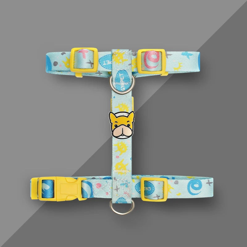 Light blue dog harness vest with yellow buckles, dog-face patch, metal D-ring