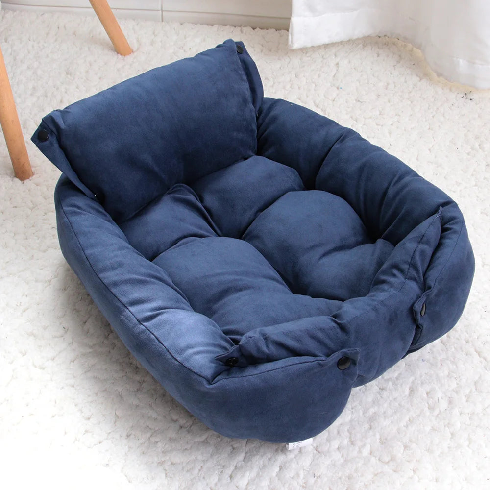 Blue pet sofa bed nest with padded bolsters, quilted center cushion, and button ties