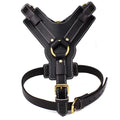 Black leather dog harness vest with adjustable straps and gold-tone metal buckles