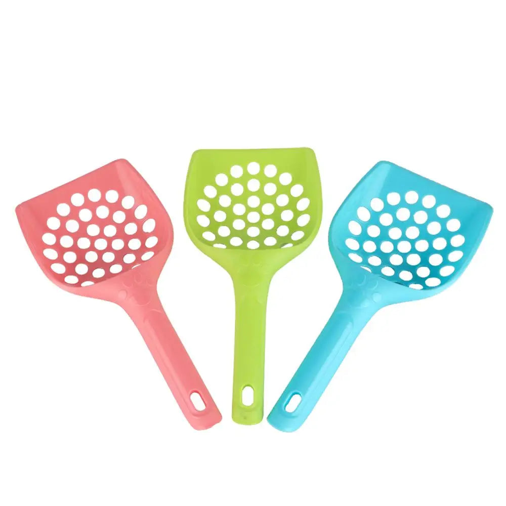Three perforated plastic cat litter shovels in pink, green, and light blue