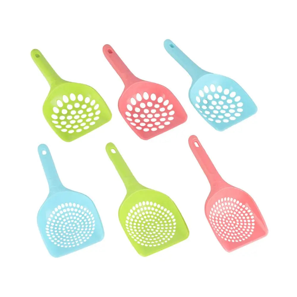 Assorted perforated plastic cat litter shovels in green, pink, and blue