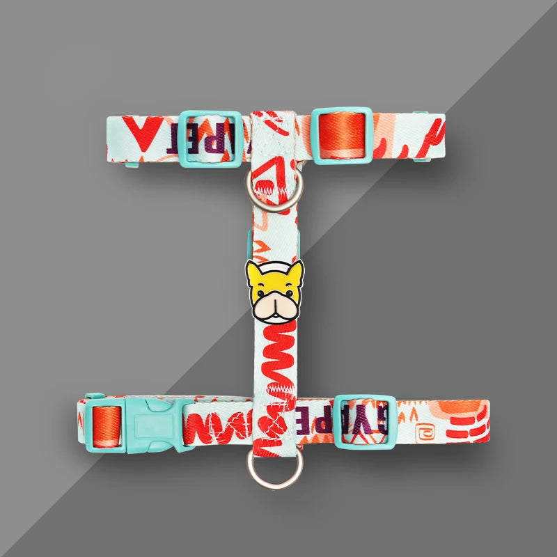 Dog harness vest with red and white patterned straps, orange adjuster, metal D-ring