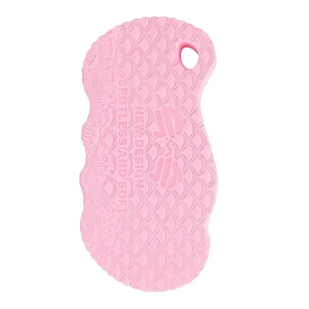 Pink exfoliating bath sponge with embossed scale pattern and thumb hole