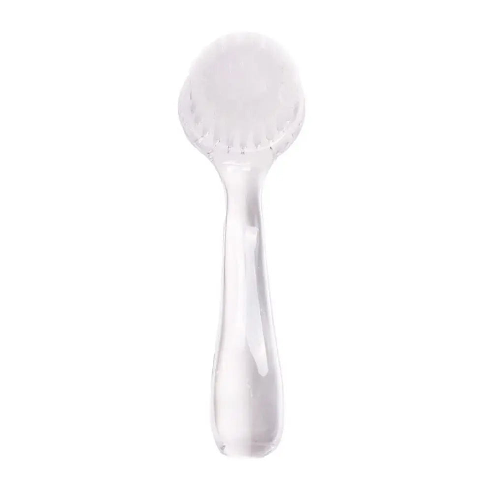 Small animal grooming brush with soft white rounded bristle head and translucent handle