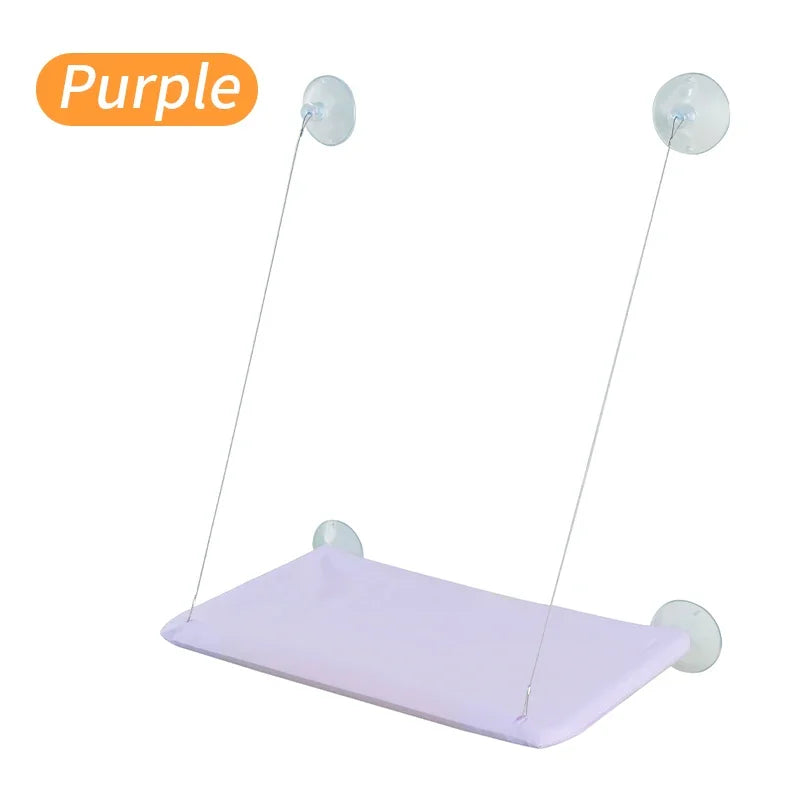 Purple window cat hammock bed with padded fabric and hanging suction mounts