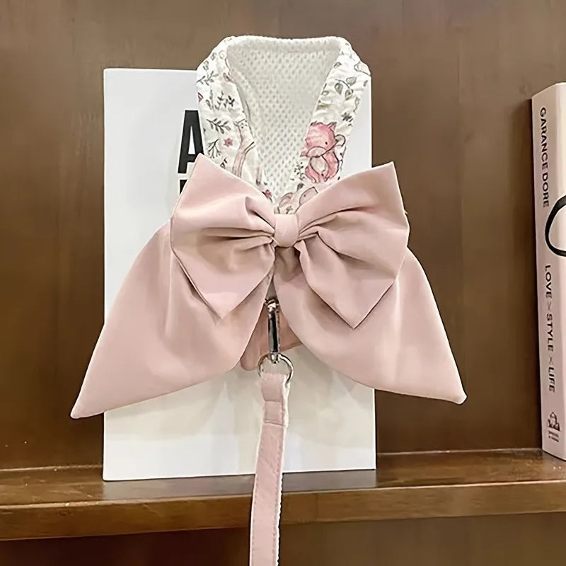 Pink dog vest harness with large bow and attached leash loop