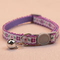 Purple floral cat collar with bell, metal ring, and round snap buckle clasp
