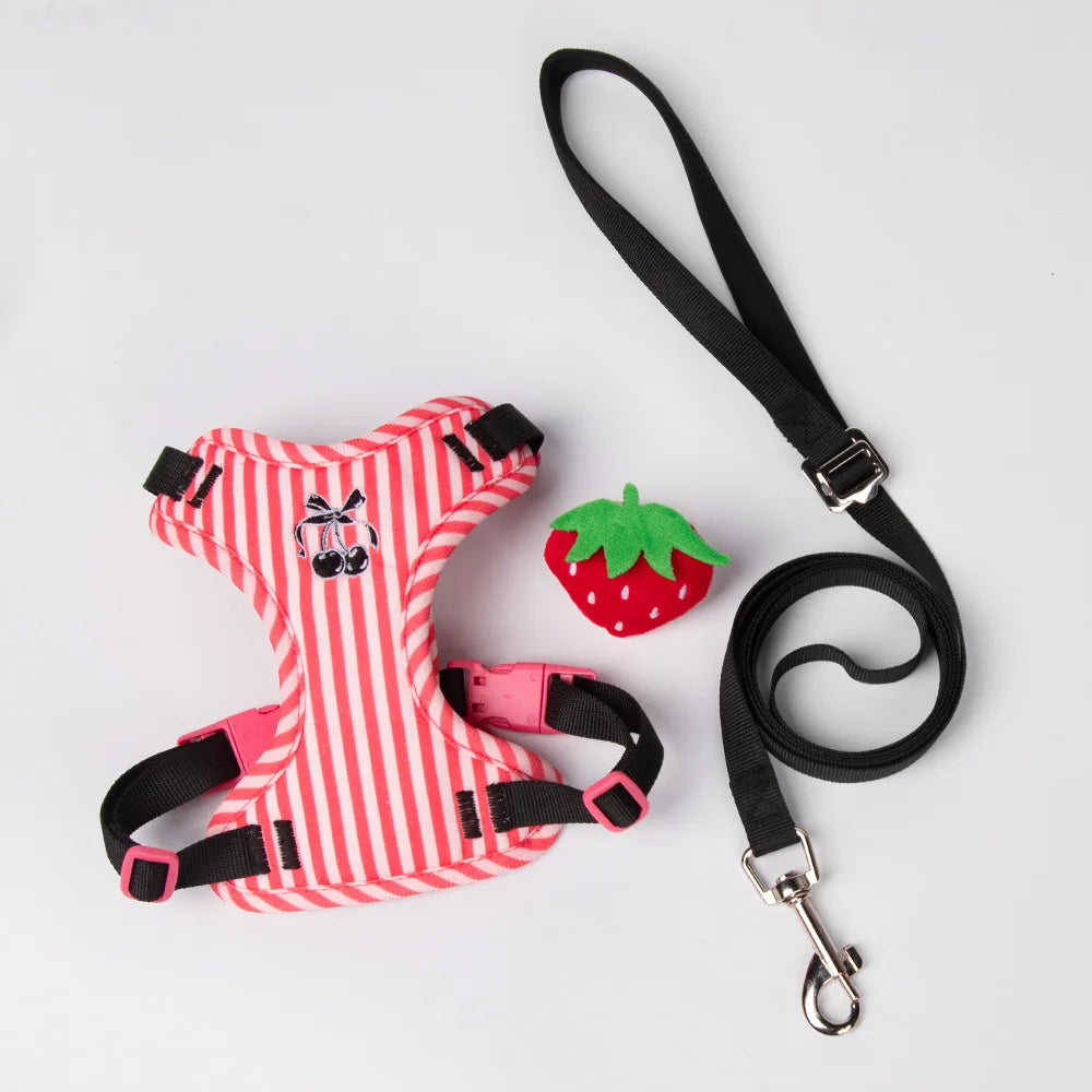 Striped dog harness with black leash strap and metal clips, plush doll accessory included