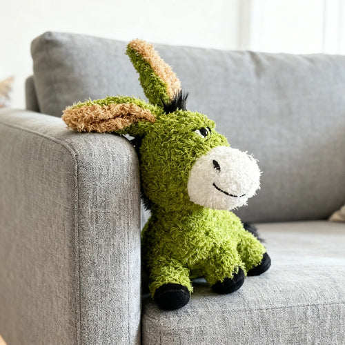 Green donkey plush squeaky toy with tan inner ears and white face patch