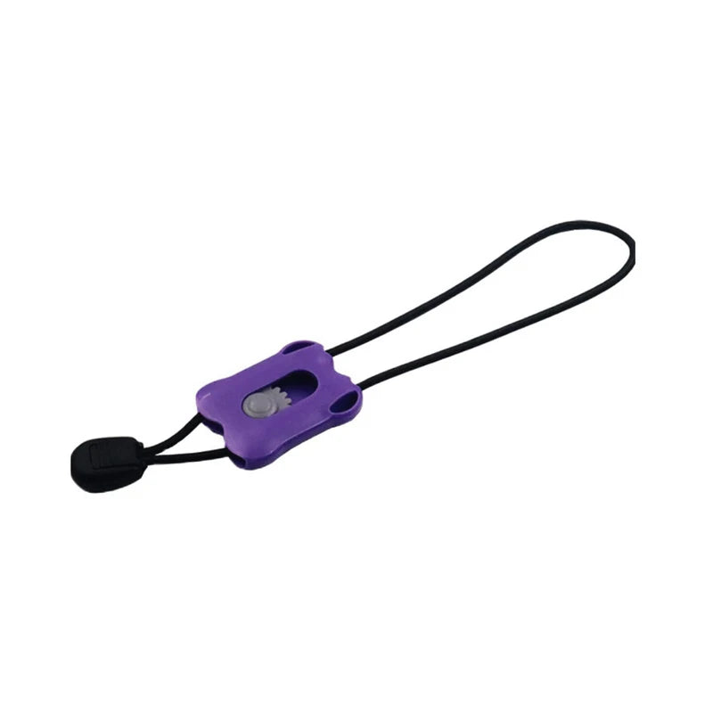 Purple plastic medical tourniquet band with black elastic strap, close-up
