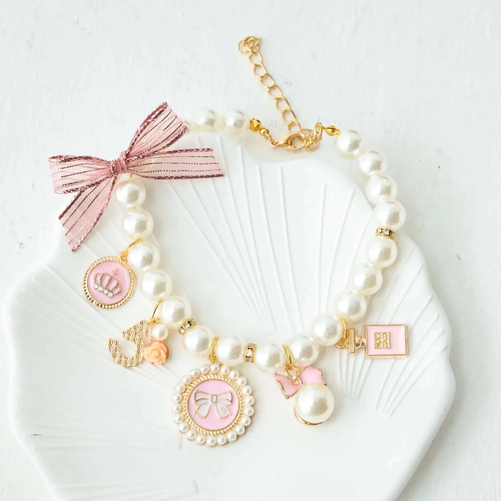 Pearl pet collar with pink lace bow and charm pendants, white beads