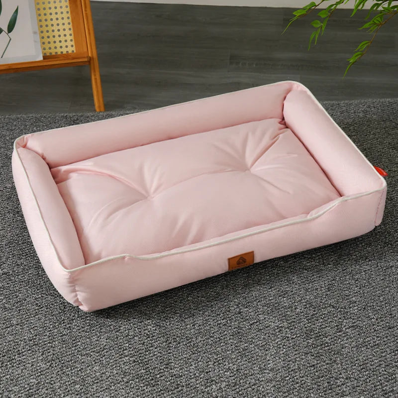 Light pink plush pet sofa bed with white piping and open padded cushion