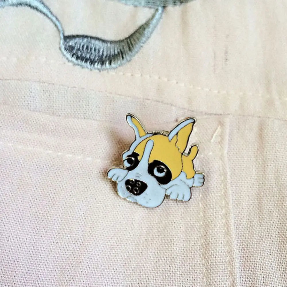 Cartoon dog enamel pin badge, blue-and-yellow husky on light fabric