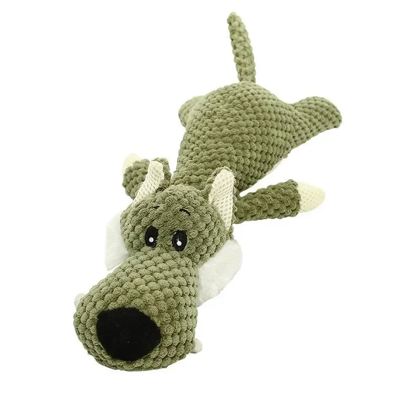 Green plush squeaky chew toy shaped like an elephant with large dark nose.