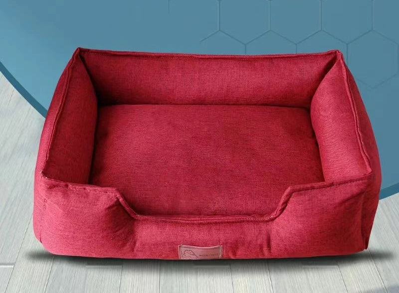 Red pet mattress with padded sides and inner cushion, logo patch at front