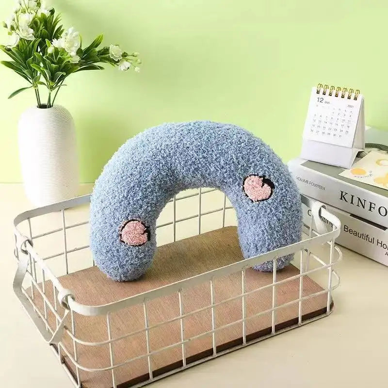Blue U-shaped plush pet pillow with pink heart embroidery