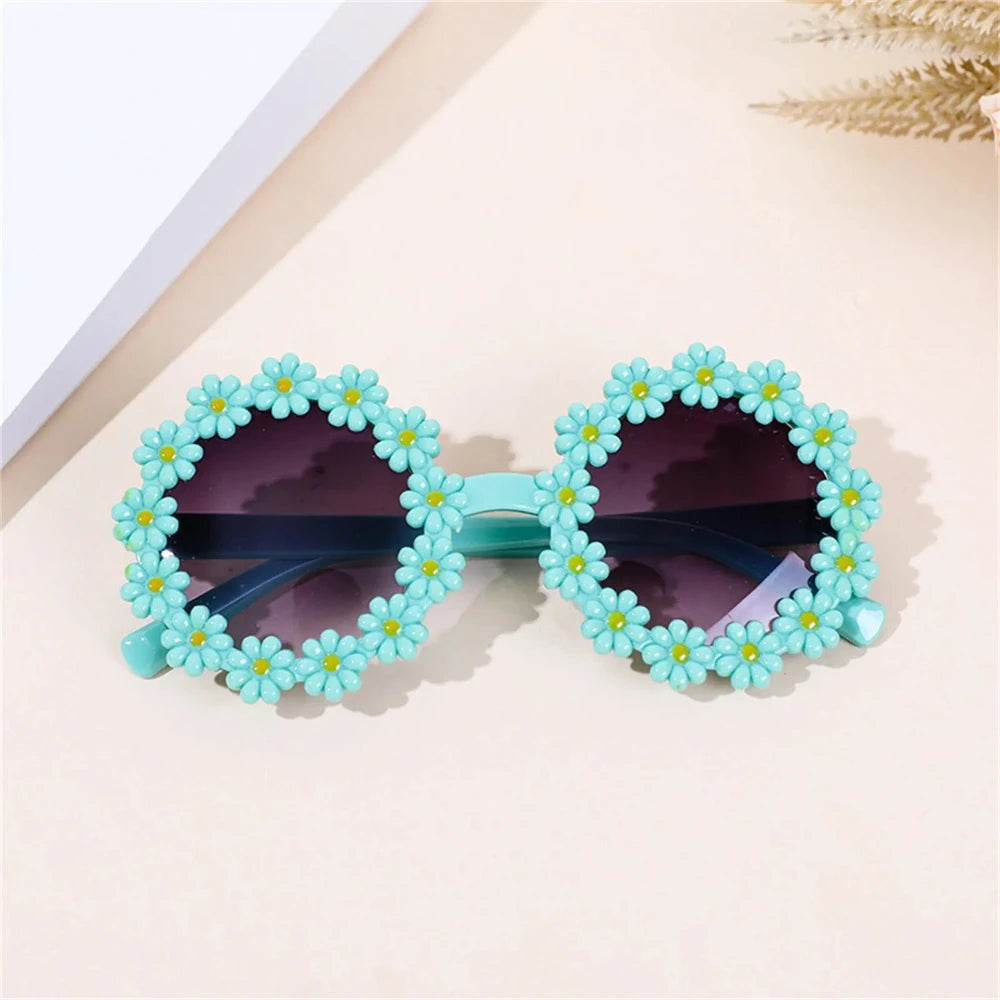Light blue daisy flower sunglasses with dark lenses and braided flower frame