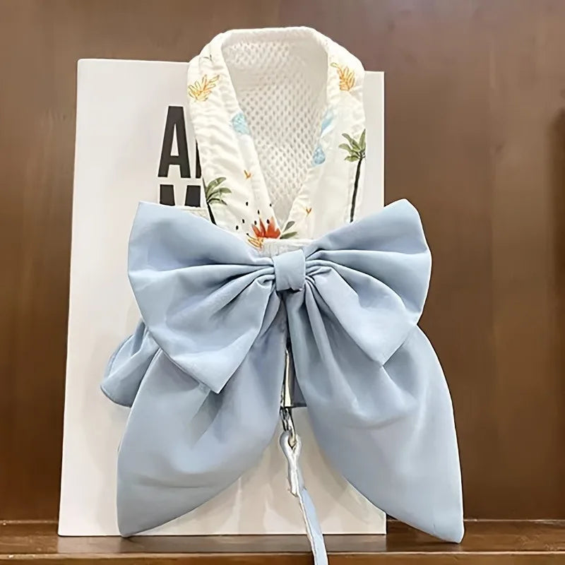 Light-blue dog vest harness with large bow and attached leash loop