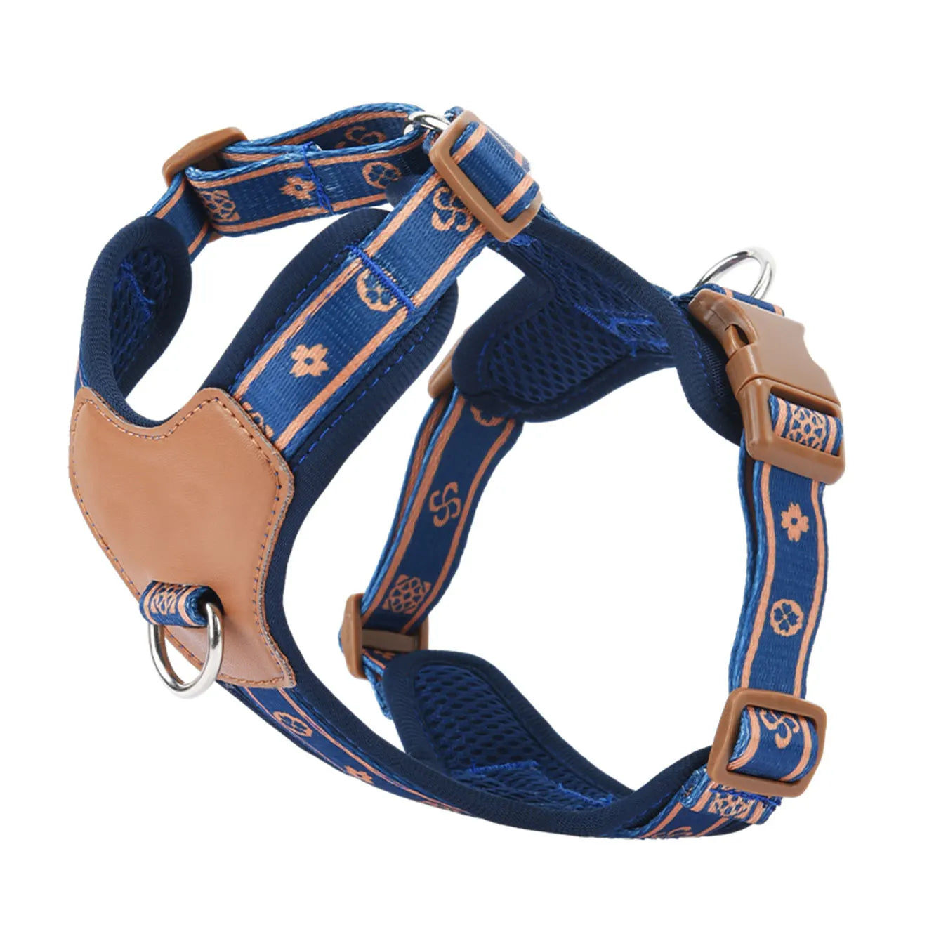 Blue dog harness with tan leather-style panels, patterned straps, and metal D-ring