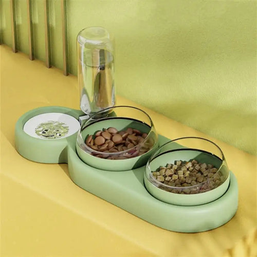 Three-bowl automatic pet feeder with clear water dispenser and two food bowls, light green base.