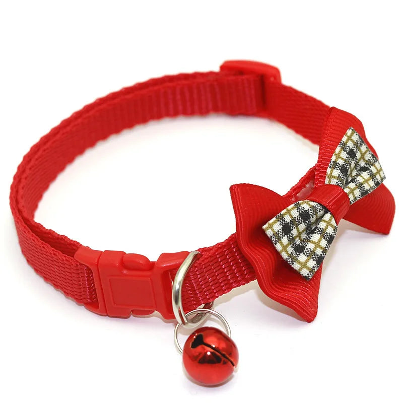 Red cat collar with plaid bow tie and round red bell