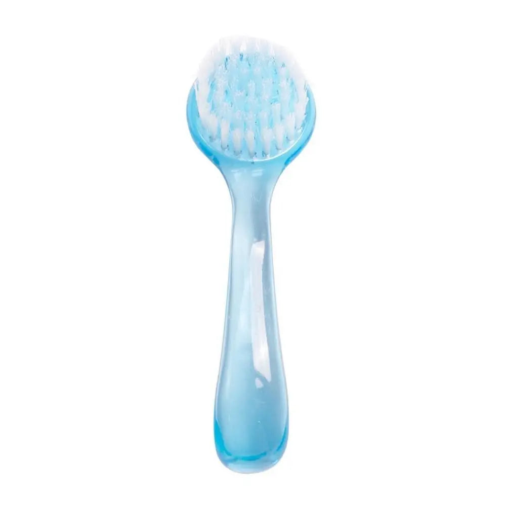 Light blue grooming brush with soft round bristle head and translucent handle