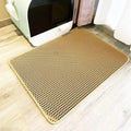 Yellow cat litter mat with raised honeycomb holes and rounded edges