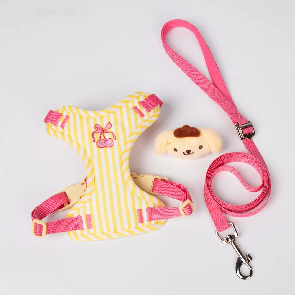 Yellow and white striped dog harness with pink leash and plush toy