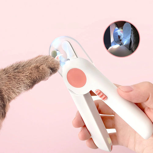 White pet nail clipper with LED light, teal accent circle and side switch