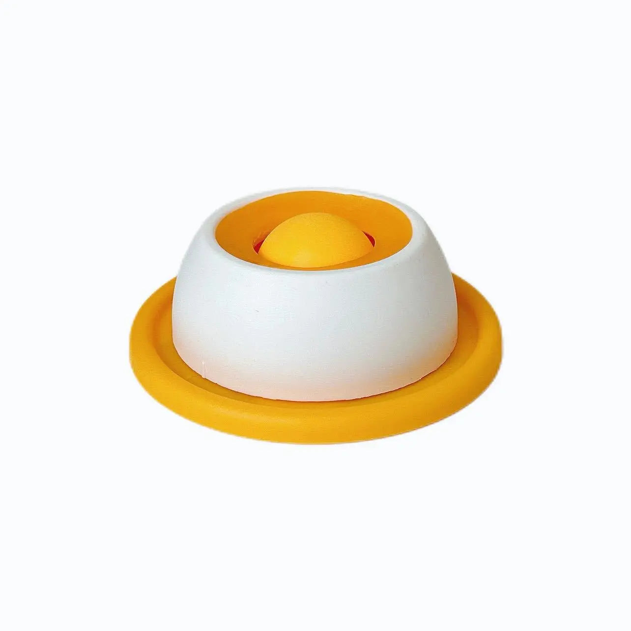Slow feeder lick bowl with white top and yellow base, orange center insert