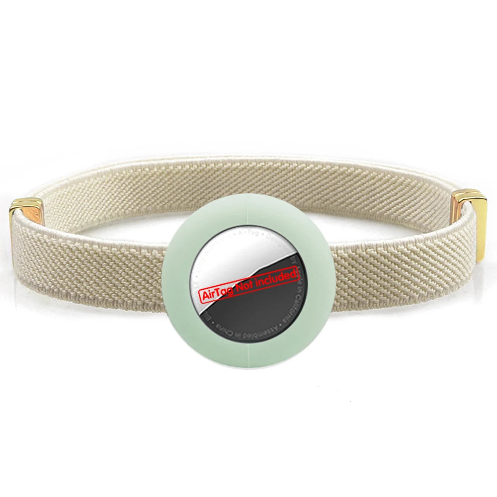 Beige cat collar with AirTag holder, safety breakaway clasp and gold hardware.