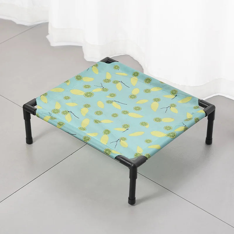 Avocado-pattern elevated dog cot with black metal legs and fabric top