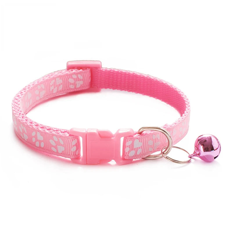 Pink paw-print cat collar with buckle and round pink bell