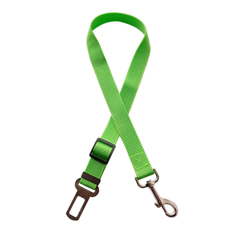Adjustable pet car safety harness clip belt, bright green strap with buckle and metal carabiner clip.