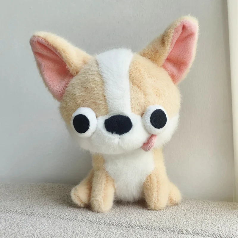 Tan and white Chihuahua plush toy sitting upright with large ears and bold stitched eyes