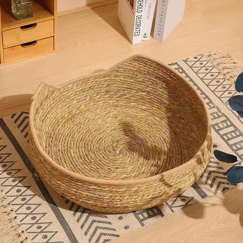 Woven rope cat bed with tan round base and white fabric cushion