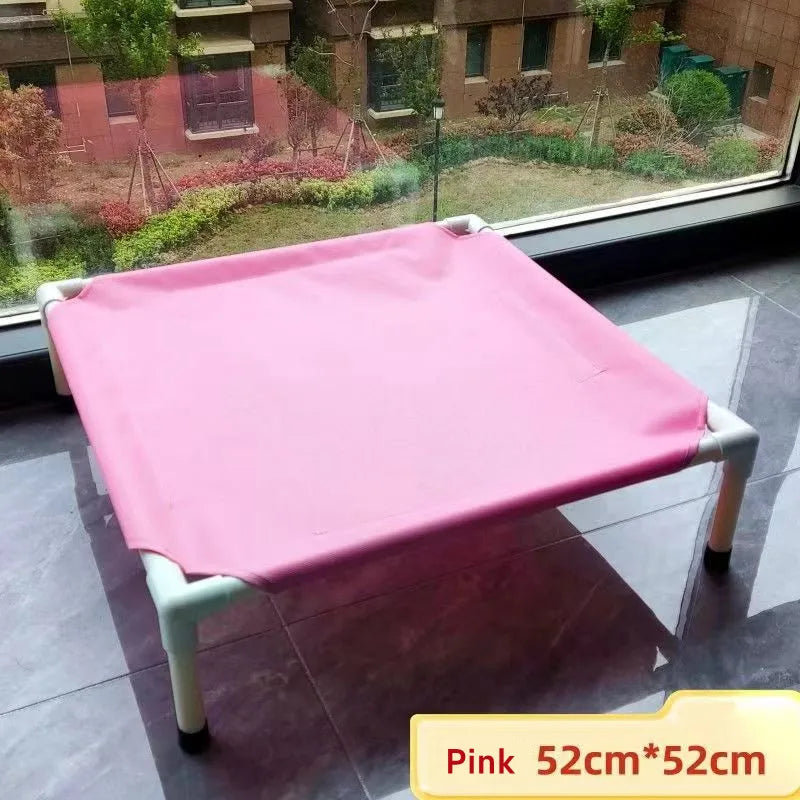 Pink foldable pet hammock bed with white legs and square fabric sleeping platform