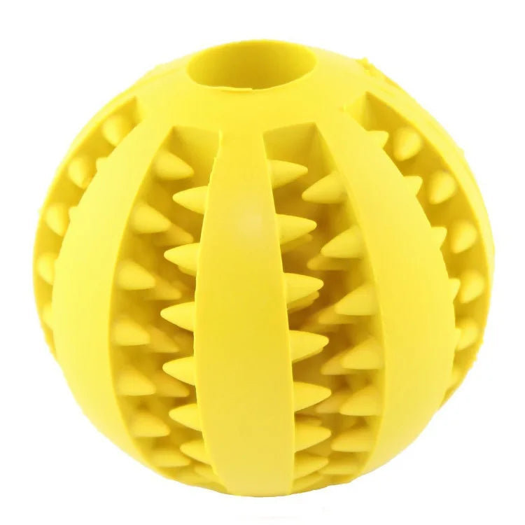 Yellow bite-resistant dog treat ball with raised tooth-grinding spikes and center divider