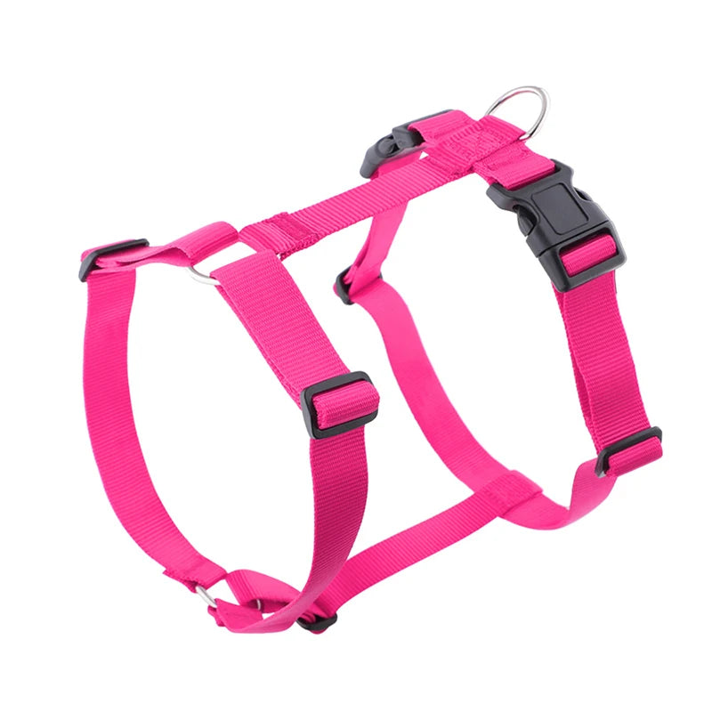 Lightweight H-shape dog harness in bright pink with black buckles and metal ring