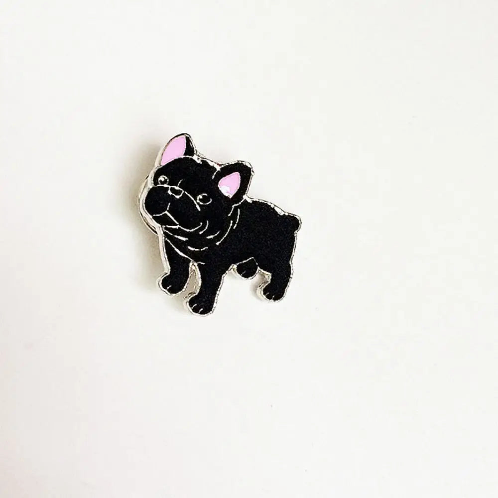 Black cartoon dog enamel pin with pink ears and silver outline