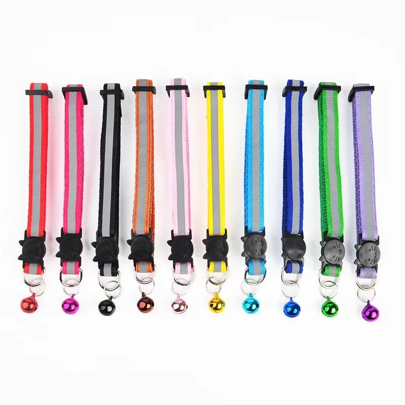 Assorted cat collars with bells, black cat-shaped holders and round bell charms