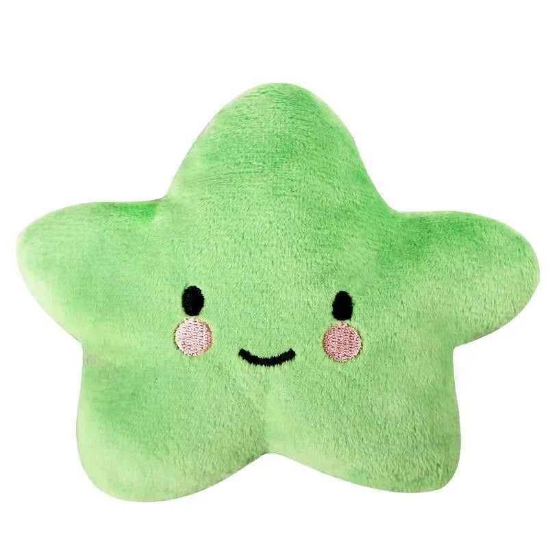 Squeaky plush pentagram pet toy in green star shape with smiling face and rosy cheek dots.