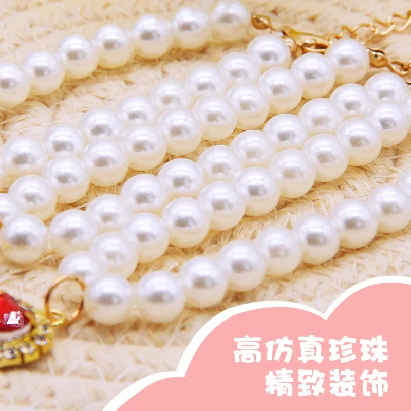 White pearl pet necklace collar strand with gold-toned clasp detail and crystal charm.
