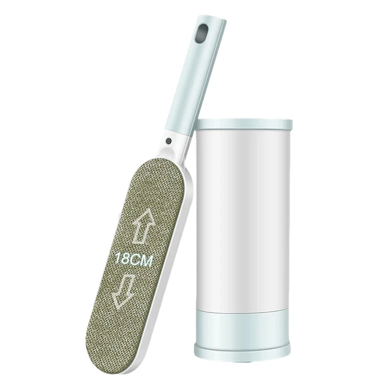 Blue lint remover pet brush with gray textured pad and white storage canister
