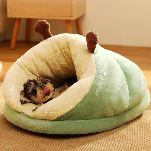 Light green and cream dog bed mattress cushion with plush hood and resting dog inside.