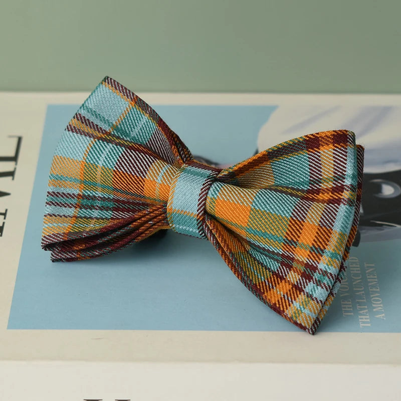 Plaid dog bow accessory with teal orange grid pattern