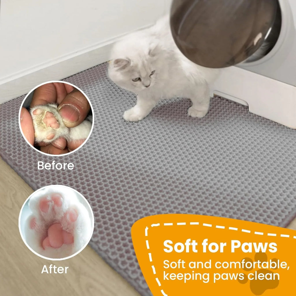Grey cat litter box mat with honeycomb surface under a standing cat