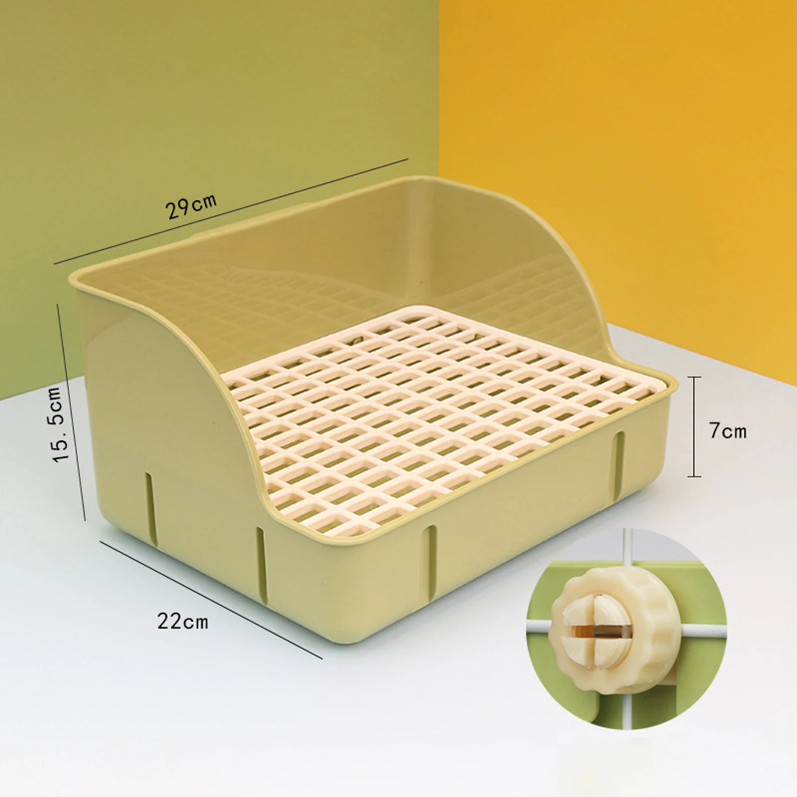 Small animal litter box with beige frame and white mesh tray, side tabs visible
