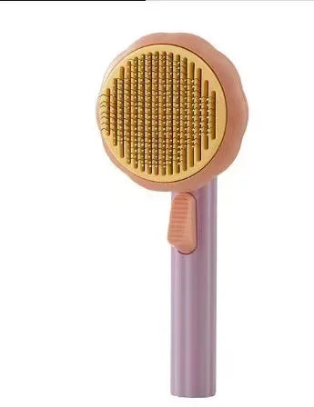 Grooming brush with mauve handle and pink round gold pin head